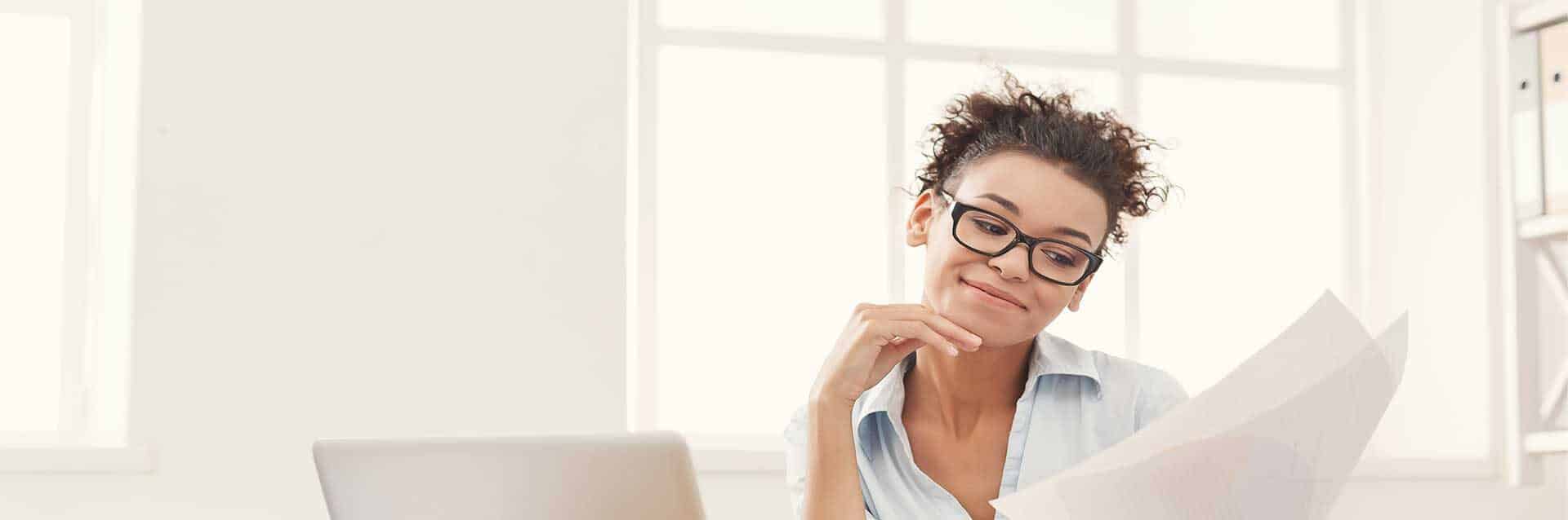Woman on the computer reviewing finances